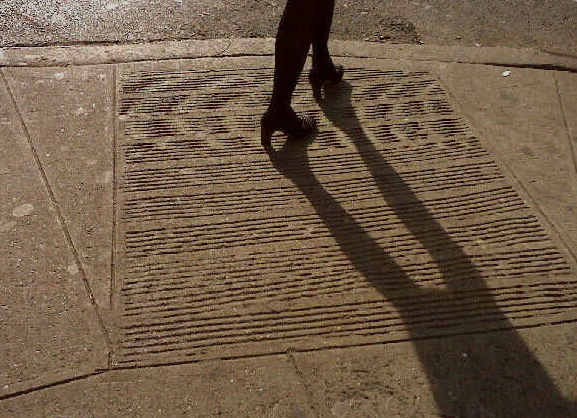 Sidewalk shadow, West 57th and 9th, NYC